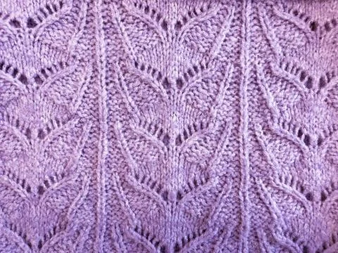 Violet knitted surface close up, concept color of the year 2022. Stock Photos