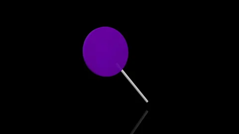 Violet Lollypop turns on itself - loop animation - black background Stock Footage 255463517