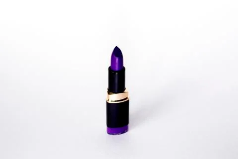 Violet matte lipstick on a white background Stock Photos