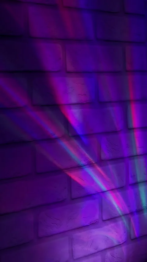 Violet neon glow on brick wall background with vibrant urban lighting effect. Stock Footage 336947866