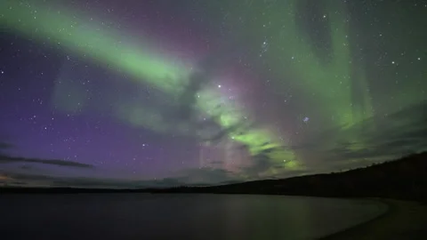 Violet Northern Lights on diffuse sky Stock Footage 250292456