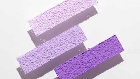 Violet powder with dynamic shadows on light gray Stock Footage 340502016