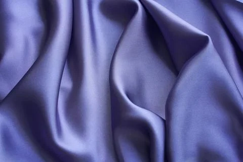 Violet silk fabric with soft elegant folds. Creative abstract background. Stock Photos
