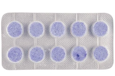 Violet tablets in package on isolated background Foto stock