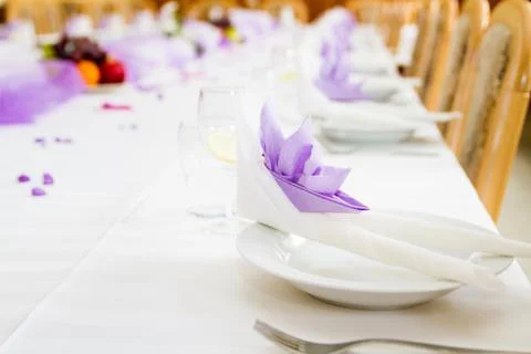 Violet wedding or reception table ready for meal Stock Photos