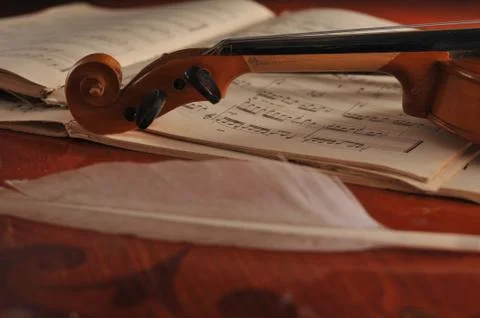 Violin and notes on the table 스톡 사진
