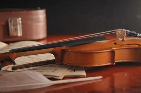 Violin and notes on the table 스톡 사진