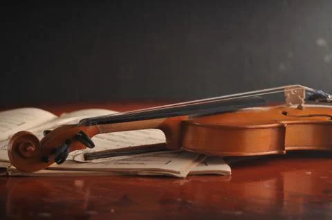 Violin and notes on the table Stock Photos