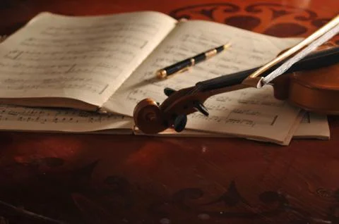 Violin and notes on the table 스톡 사진