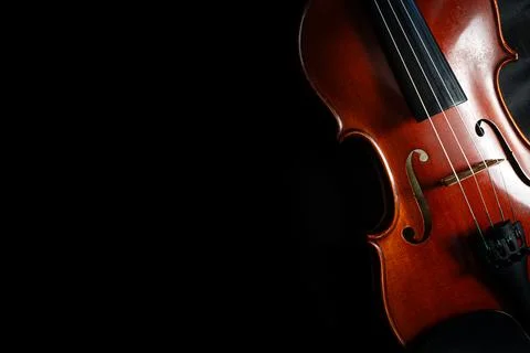 Violin on Black Background with Dramatic Lighting Stock Photos