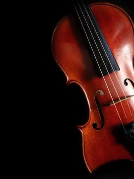 Violin on Black Background with Dramatic Lighting Stock Photos