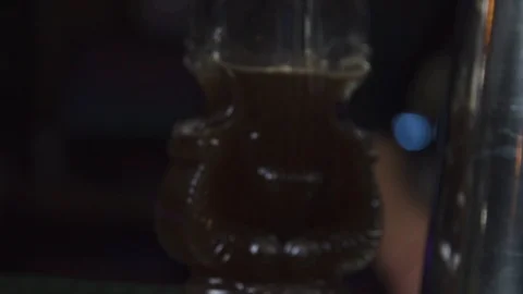 Violin bottle being grabbed and juice poured into glass Stock Footage 90123964