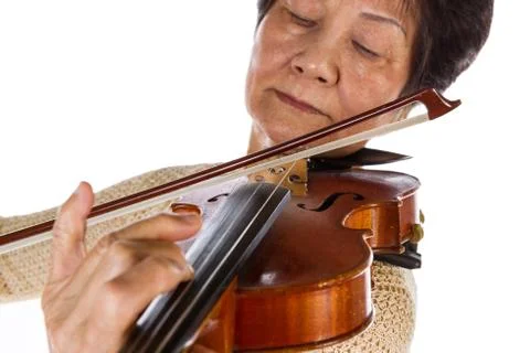 Violin bow and strings touching perfectly by its master senior player Foto stock