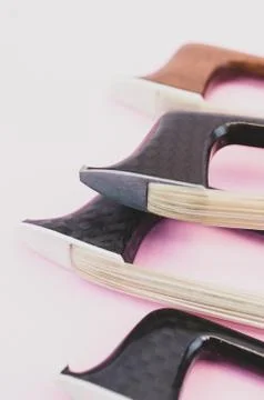 Violin bows tip view - string instruments Stock Photos