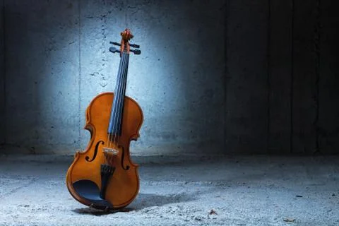 Violin on concrete wall Stock Photos