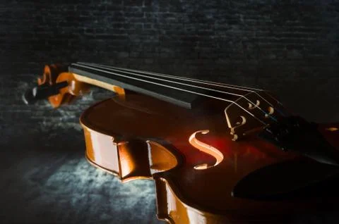 Violin on concrete wall Stock Photos