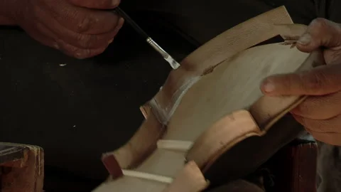Violin Maker Applying Glue to Wood at Workshop - Chaco Province, Argentina Video stock 254823228