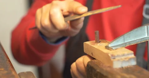 Violin maker Cine 4k [External audio] - scraping away Stock Footage 59172589