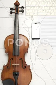 Violin With Music Paper Note Keyboard Computer Dvd Disc And Smart Phone