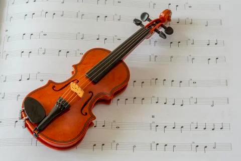 Violin on note paper Stock Photos