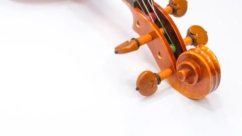 Violin scroll with tuning pegs close up Stock Photos