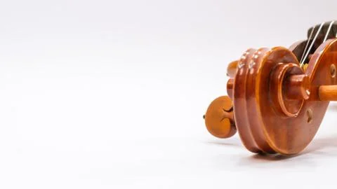Violin scroll with tuning pegs close up Stock Photos