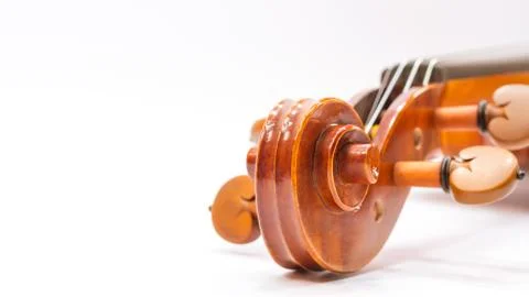 Violin scroll with tuning pegs close up Stock Photos