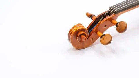 Violin scroll with tuning pegs close up Stock Photos
