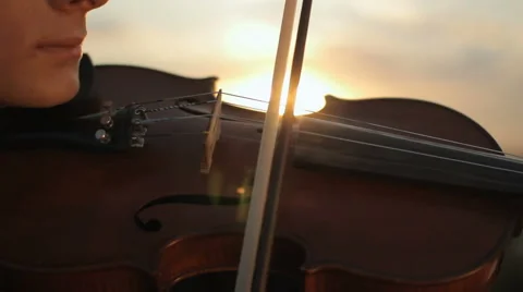 Violin. Violinist playing at sunset. Strings violin and bow Stock-Footage 66526660