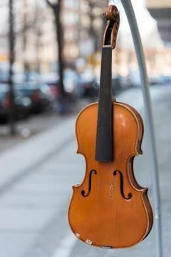 A violin without strings hangs on the hook Stock Photos