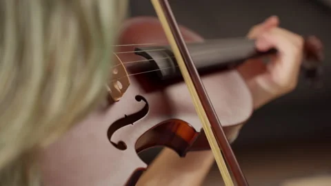 Violinist performing intricate melody with precise bow movements, creating .. Stock Footage 316618378
