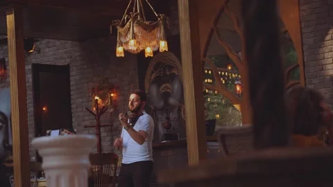 The violinist performs in a restaurant Stock Footage 288986966