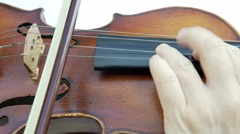 Violinist playing the violin on white background. Close up, hands isolated. 4K Stock Footage 65452604