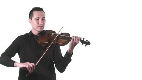 Violinist plays fast melody on a classical violin. Medium long shot. Isolated Stock Footage 134495206