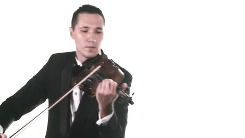 Violinist in tuxedo performs a slow composition on a classical violin. Isolated Stock Footage 134495526