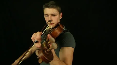 Violiniston a black background Stock Footage
