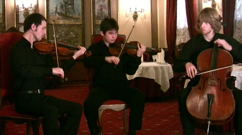 Violinists and violoncellist Stock Footage