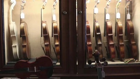 Violins  in a luthier shop Stock Footage 83446790