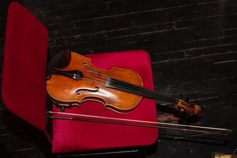 Violns on chairs during interval Stock Photos