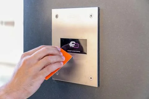 VIP approaching contactless card to reader in order to unlock security contro Foto stock