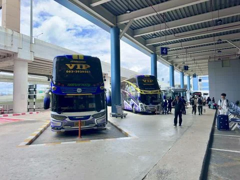 VIP double decker buses parked at the passenger pickup area of Don Mueang Stock Photos