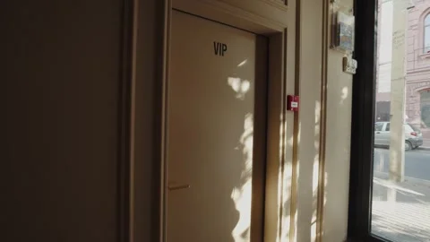 VIP Room Door with Sunlight Reflections Stock Footage 302489685