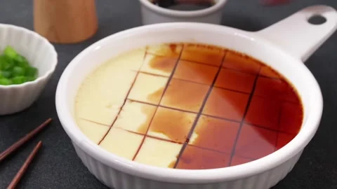 Viral steamed egg custard, silky Asian egg Pan-Steamed Omelette Stock Footage 337231658