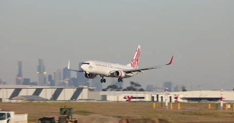 Virgin Australia Airlines Boeing 737 airliner landing at Melbourne Airport. Stock Footage 154946523