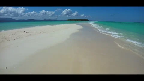 Virgin beach and turquoise ocean - drone anamorphic footage of Nosy Iranja Stock Footage 323779768