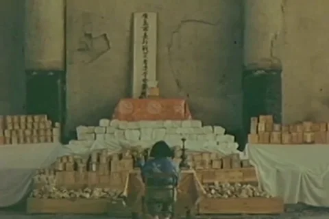The Virgin kneels in front of the boxes in prayer - 1946 Stock Footage 103722088
