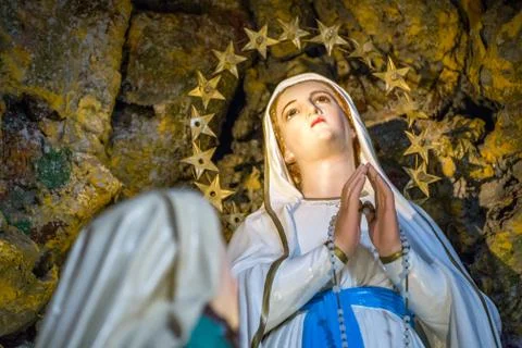 Virgin of Lourdes in cave Stock Photos