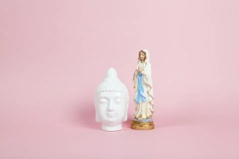 Virgin Mary and white Buddha pink Stock Photos