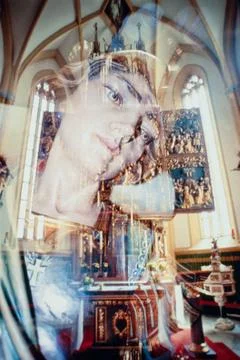 Virgin mary ghostly image reflection in church Stock Photos