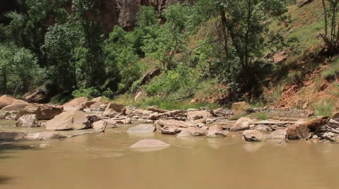 Virgin River flows across a rocky river bed in Zion Canyon Stock Footage 40715903